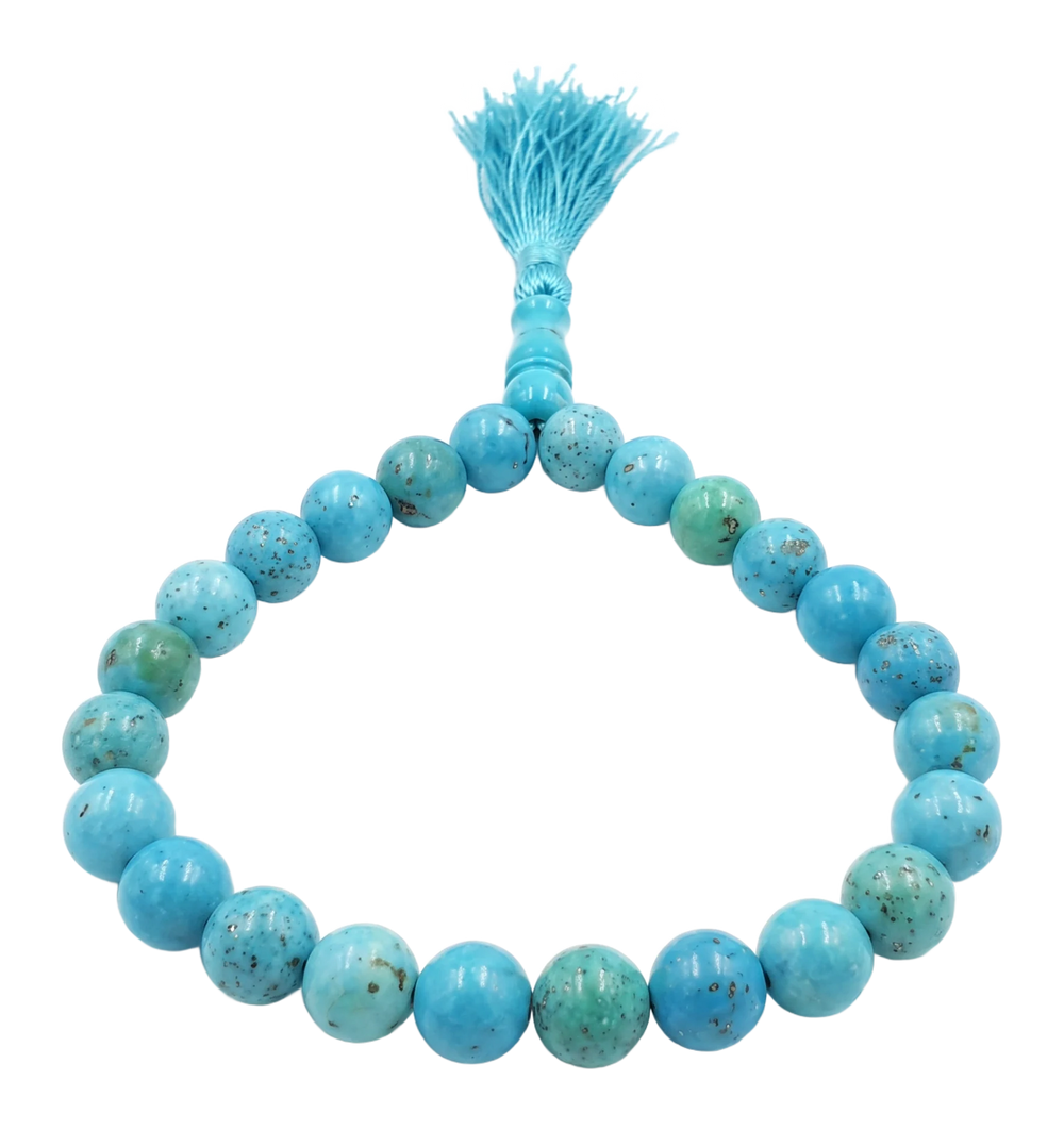 Tasbih di grani tondi in turchese con nappa azzurra e cartoncino di certificazione
