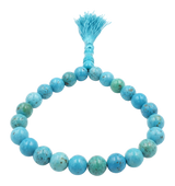 Tasbih di grani tondi in turchese con nappa azzurra e cartoncino di certificazione