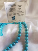 Tasbih di grani tondi in turchese con nappa azzurra — fotografia in bottega